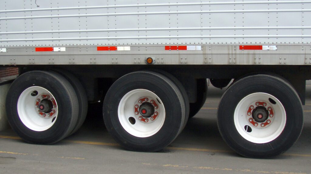 Close-up commercial truck wheel with retained nuts