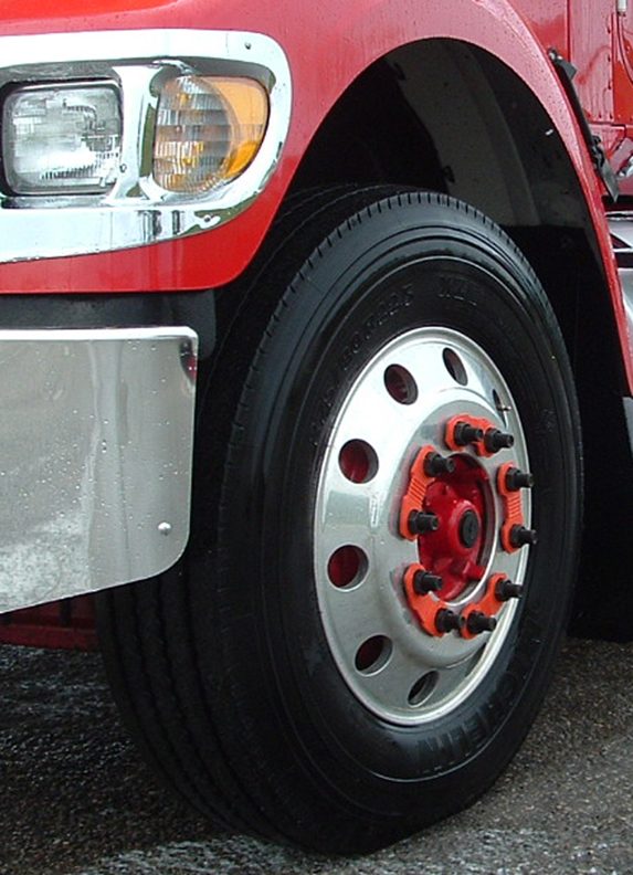 Close-up commercial truck wheel with retained nuts